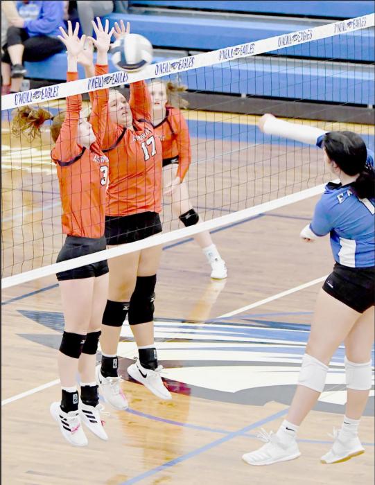 Eden Raymond (#3) and Kaitlyn Nelson (#17) team up for a block against an O’Neill Eagles attacker.