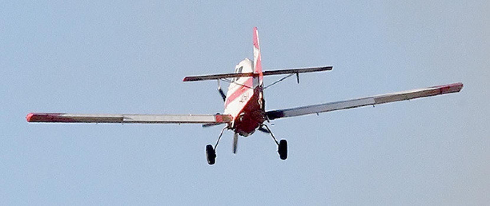 The SEAT plane from Valentine assisted with fire suppression at Saturday's grass fire. The plane made a number of passes dumping fire retardant on the grass fire.