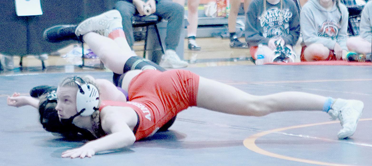Jolyn Pozehl pinned all four of her opponents at the Higgins Invitational in Lexington to take first place in the 110 lb. weight class.
