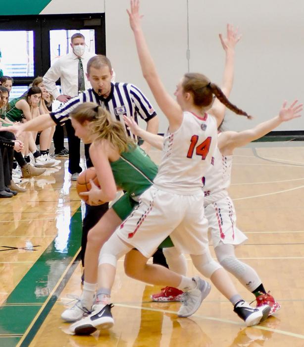 Cameryn Goochey and Emma Sears box an Elhorn Valley player against the sideline forcing a turnover.
