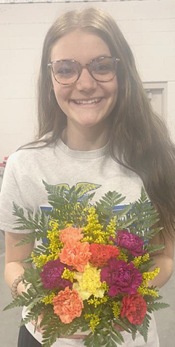 Ainsworth students have the opportunity to take floriculture and work on their floral design skills. Showing off one of their completed floral design projects are Terra Shoemaker (left) and Brianna Starkey (right).