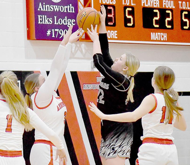 Jocelyn Good gets her fingers on the ball and deflects the shot during the Boyd County game.