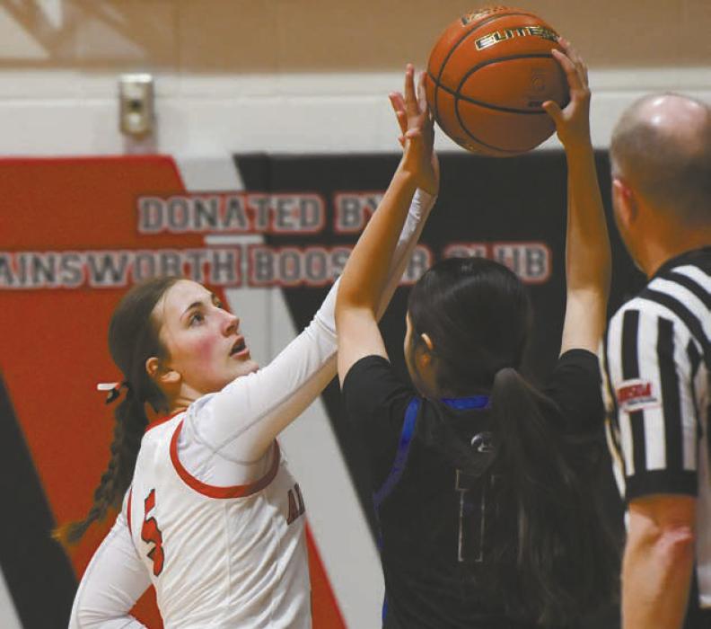 Freshman Addilyn Doke plays defense against Niobrara/Verdigre’s McKenzie Runnels.