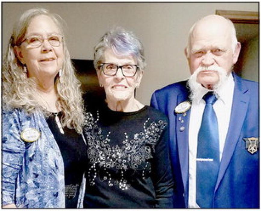 Worthy Matron Peggy Hitchcock, Jean Kops and Worthy Patron Mike Hitchcock celebrate the 75 year membership pinning by Worthy Grand Matron Lori Sieg.