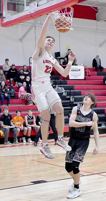 Carter Nelson picks up two of his 10 points against Chambers/Wheeler Central with a dunk.