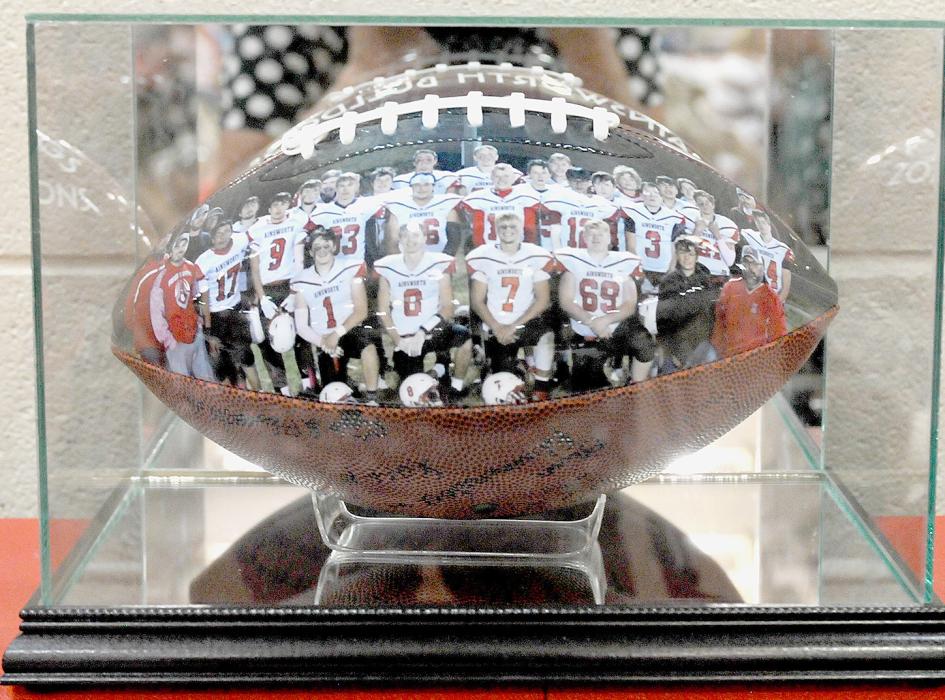 One of the higher priced items to be purchased was the 2022 Class D2 District Champions colored autographed football in a case.