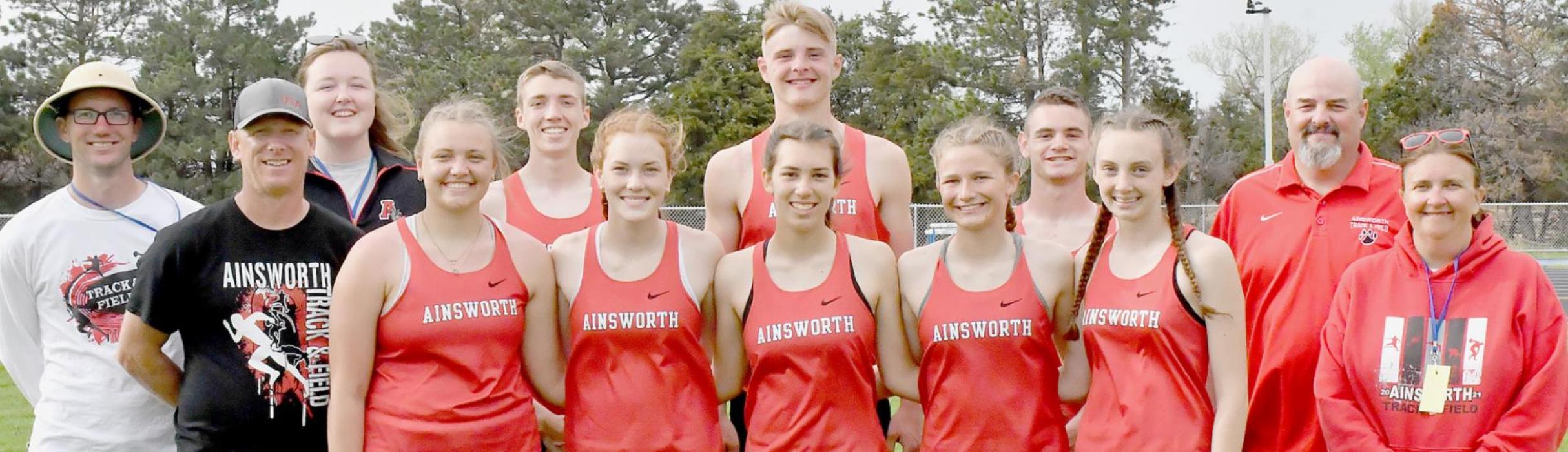 Wade Alberts (second from left) was part of the AHS Coaching Staff that took eight athletes to the 2022 NSAA State High School Track Meet.
