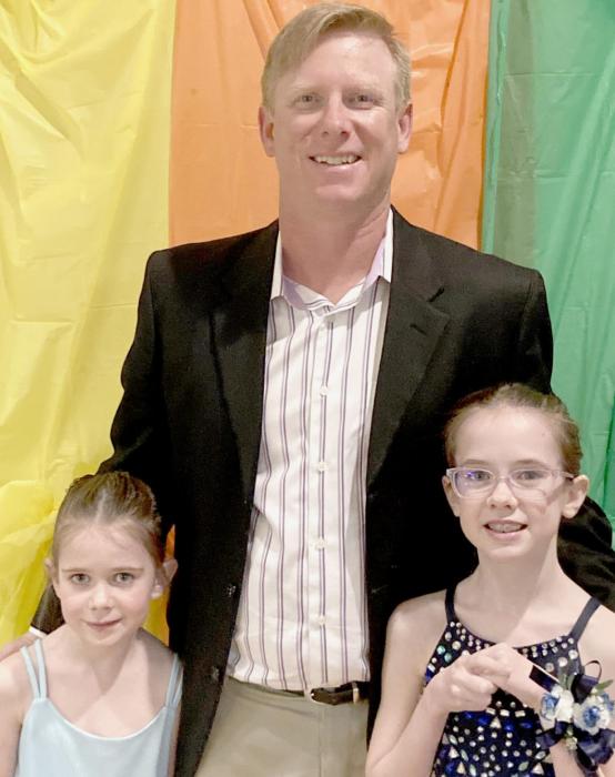 Last year, AHS Alumni Wade Alberts (centered) was gearing up for Tokyo, his third Olympic Games. This year, he’s gearing up for his first year as a P.E. teacher at Ainsworth High School. He is pictured with his two daughters (left to right), Rowan and Tegan.
