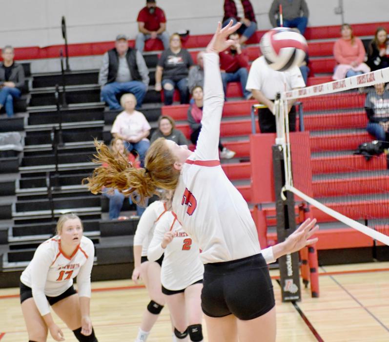 Left: Eden Raymond swings for one of six kills against the Stuart Broncos on October 12th.