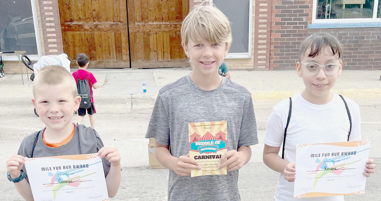 One Mile Winners were (Left to Right): Boys Division: 2nd Connor Rolloff , 1st Paul Denny and 3rd Gael Barcenas (Not Pictured); Girls Division: 1st Renata Barcenas and 2nd Shelby Rolston (Not Pictured).