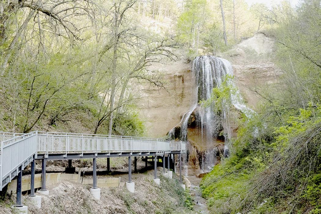 The new boardwalk, constructed of composite decking on a steel frame, leads visitors to Smith Falls. Photo by Justin Haag/NGPC