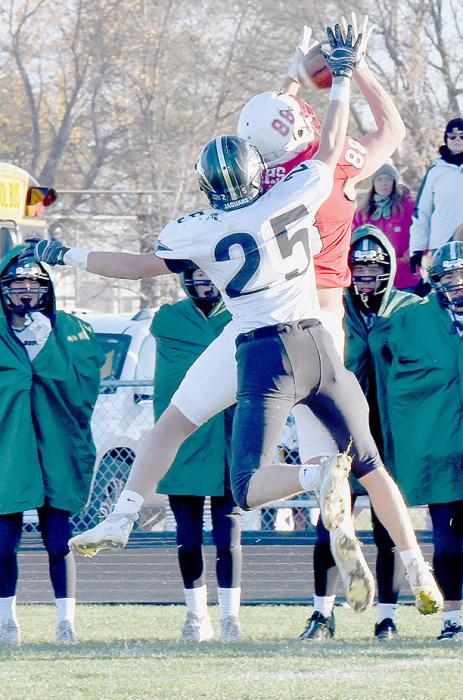 Trey Appelt goes up for a pass reception but was pushed by Dylan Brichacek of Howells-Dodge. The pass was incomplete, but Brichacek was penalized for pass interference.