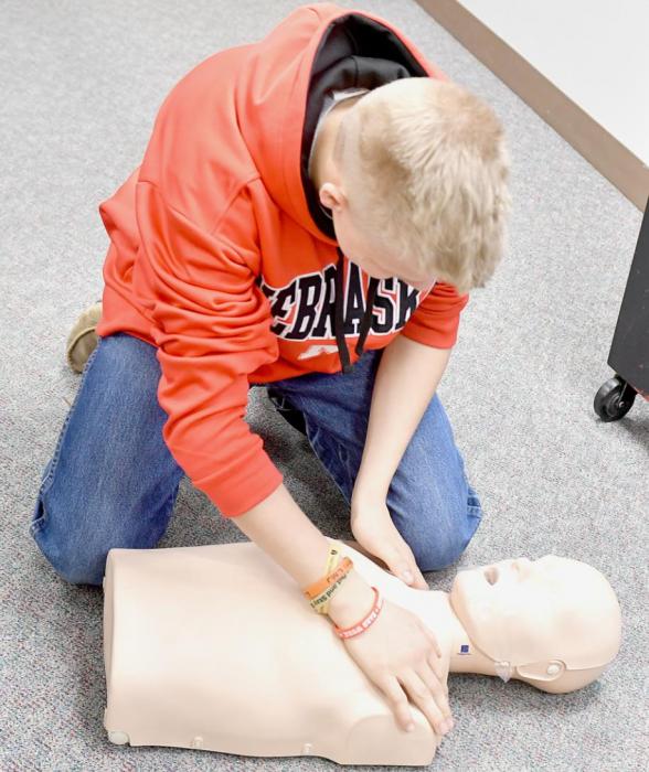 One of the first steps of CPR is to check the person for responsiveness, which Mason Painter demonstrates above.