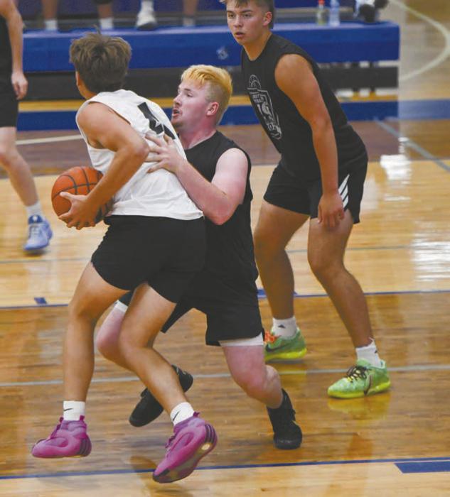 Witten Painter guards Jarek Erickson of Elgin Public/Pope John. Erickson was named the MVP of the game.