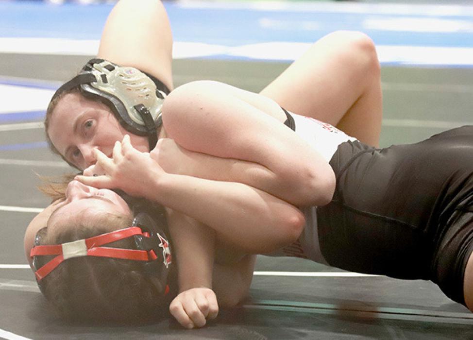 Tatum Nickless pinned Lilyanna Dziurawiec of Homer in the 110 lb. weight class.