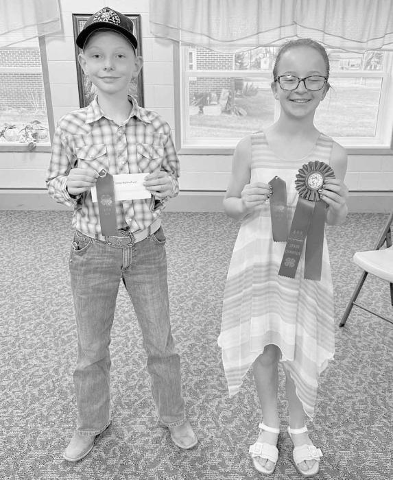 Dane Dvorak of Bassett (left) and Collins Moravec of Bassett (right) stand with their ribbons after competing in the Junior Division.