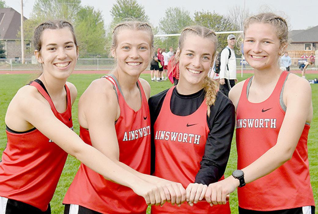 The Ainsworth 4x800 Relay team of (left to right) Katherine Kerrigan, Kendyl Delimont, Cheyan Temple and Emma Kennedy took first at Districts to qualify for the State Track Meet.
