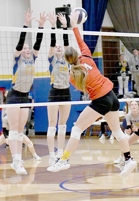 Cheyan Temple goes to the right of West Holt players going for a block during Subdistrict play in Atkinson.