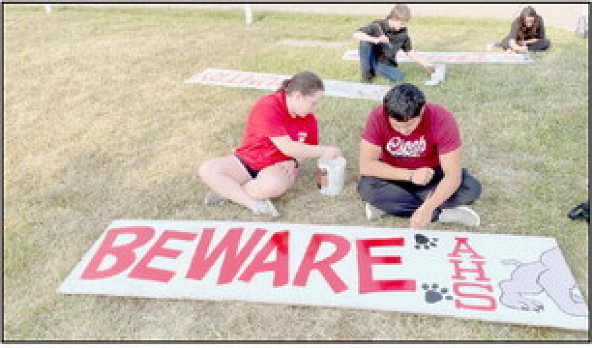 Giving the 'Beware Bulldog Country' sign a face lift at East City Park were (Left to Right): Annick Altamirano, Brian Eick, Trevor Pike, Sam Titus, Adysson Sears and Madison Phares. More pictures can be found on page 7.