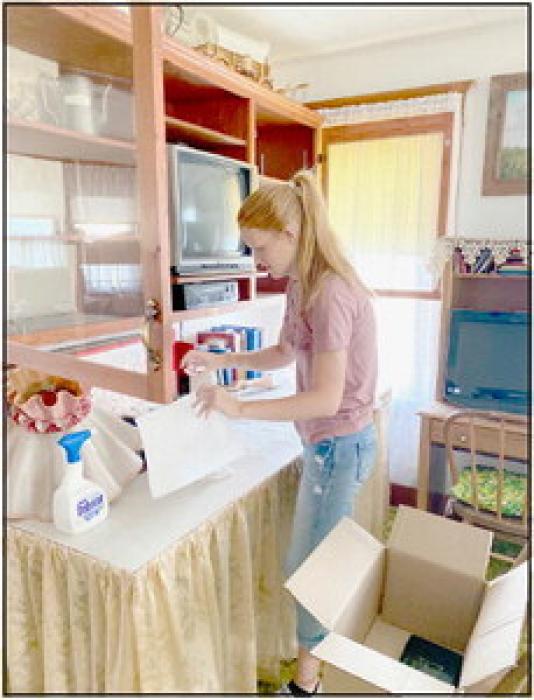 (Left) Abbigail Paulson and Emma Mc-Murtrey and (above) Terra Shoemaker were some of the students who helped pack the items up at the Coleman House Museum in preparations for the building to be moved.