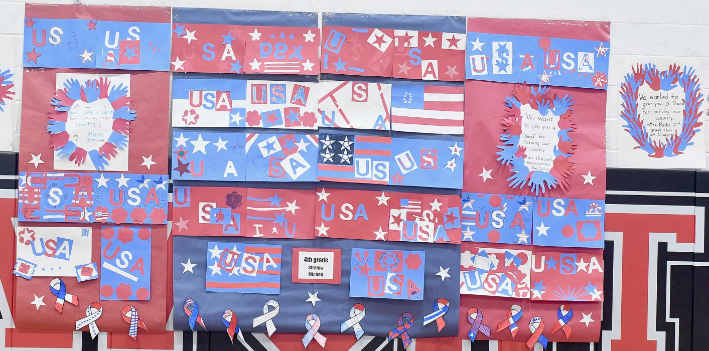 The students at Ainsworth Community Schools were busy making lots of Veteran signs and signs about the United States of America that were displayed throughout Lila McAndrew Gymnasium and the school buildings.