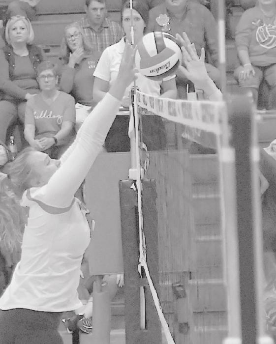 Kaitlyn Nelson battles at the net against a Burwell player during the Dawgs’ loss on September 23rd.