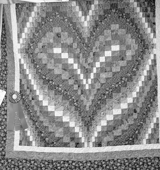 Qualifying for the 2022 Nebraska State Fair competition were these two pieces done in Machine Pieced Machine Quilted by Phyllis Skillman, above and a Fiber Arts Crocheted Vest by Joan Rudnick, right.