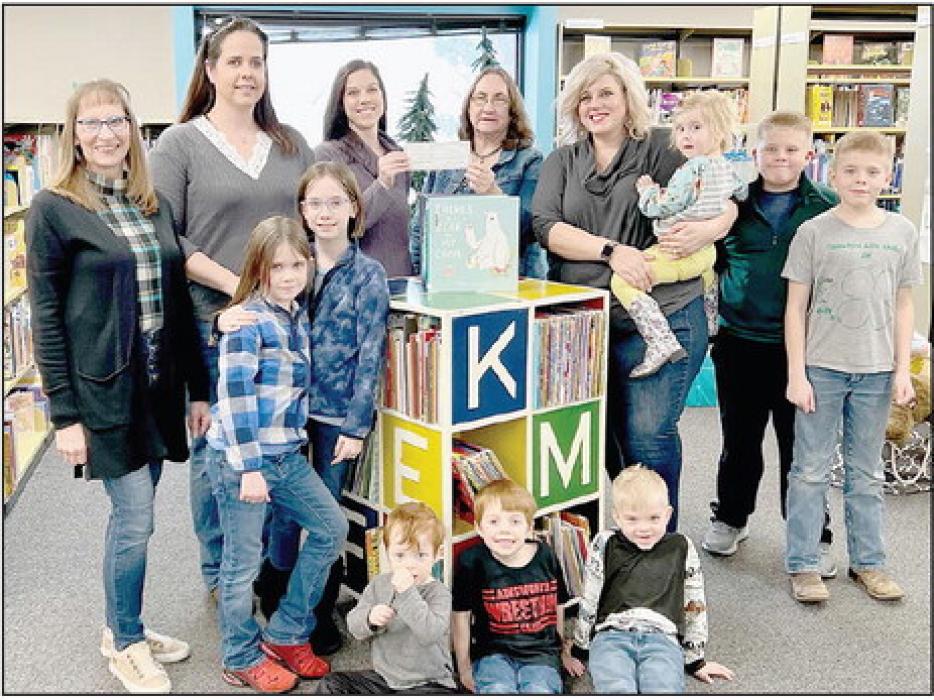 Gail Irwin, Ainsworth Librarian, presented a check for $700.00 to Chamber President Ashlie Wright for the Dolly Parton Imagination Library. Also present were Library Foundation members, Chamber members and participants in the Dolly Parton Imagination Library (Back Row - Left to Right): Marsh Fuchs, Traci Booth, Ashlie Wright, Gail Irwin, Sheena Ferris, Stella Ferris, Clayton Ferris and Caden Ferris; (Front Row - Left to Right): Rowan Alberts, Tegan Alberts, Daxton Wright, Tilden Wright and Cash Ferris.