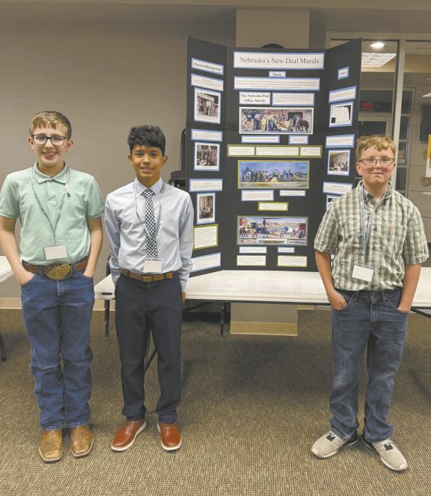 A group of Ainsworth sixth-graders (left - right): Ty Ruhter, Kevin Gomez and Matthew Clingman, presented their exhibit about Nebraska’s New Deal Murals at the State NHD Contest in Lincoln, and qualified for the national competition this summer.