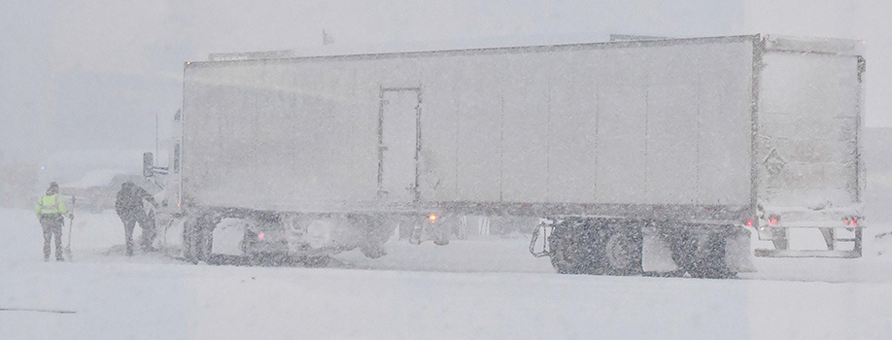 One of the first casualties of last week's snow storm was a truck driver on Monday afternoon, January 2nd. The driver was turning into Speedee Mart and due to limited visability caused by heavy snow, he drove into a pile of snow, getting stuck. Brown County Sheriff's Deputy B.J. Nilson attempted to help the driver scoop out his truck. A front-end loader was finally rounded up to push the truck out.