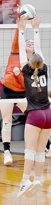 Cecelia Addison of Stuart gets a partial block of a spike by Ainsworth’s Gracyn Painter. The partial block went out of bounds for an Ainsworth point.