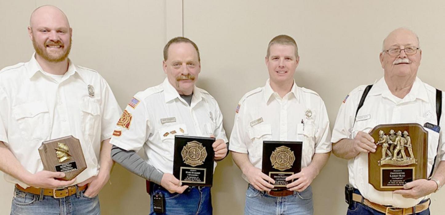 Several firemen were recognized for their years of service to the Ainsworth Fire Department. Those recognized were (left to right) Drake Fiala - 5 years, Kurt Starkey and Devin Painter - 15 years and Larry Rau - 40 years. Also receiving service awards, but not pictured, were Hunter Nickless - 5 years, Justin Nickless - 15 years, Carl Hart - 25 years and Bruce Dannatt - 35 years.