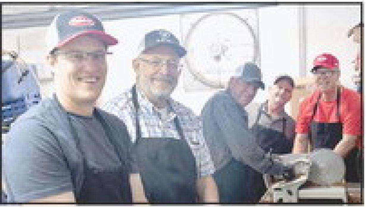 As with any barbecue, there has to be the “guys” in the background cutting up the meat.