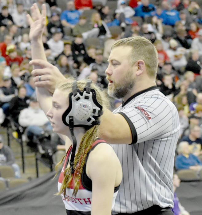 Jolyn Pozehl raises her hand at the winner of fifth place in the first sanctioned NSAA All-Class State Wrestling Championship. Pozehl defeated Ella Reeves of Battle Creek to take fifth place in the 114 lb. weight class.