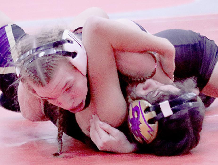 Joylyn Pozehl took first place in the 115 lb. weight class. Pozehl pinned all five of her opponents on her way to first place at the Amherst Invitational Wrestling Tournament on January 28th. Photos by Jessica Pozehl