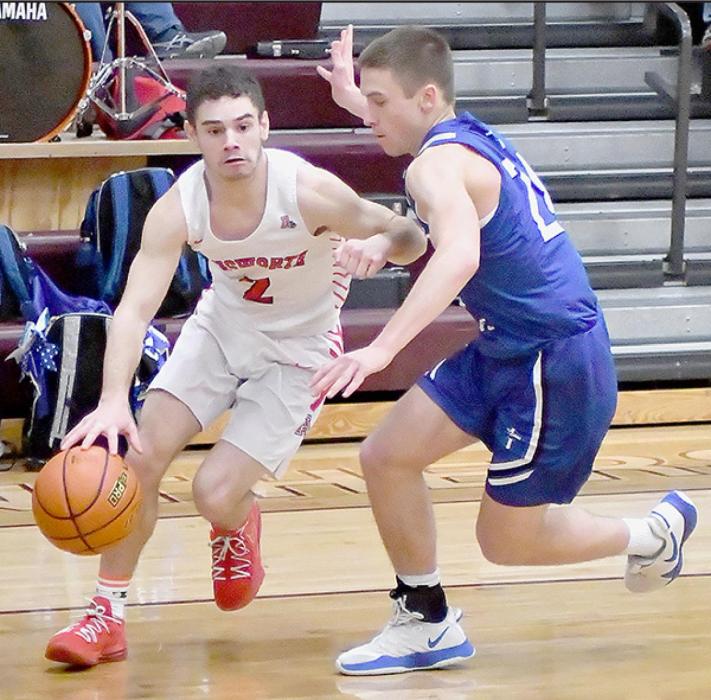 Senior Caleb Allen drives around a Lourdes Central Catholic defender in the District Final. Allen averaged 11.9 points per game and 1.5 assists per game this season.