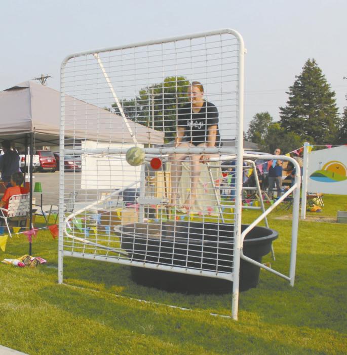 Elementary Principal Kelsey Riesen sat on the dunk tank during the event, while her students tried to give her a dunk!