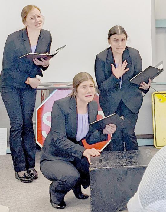 Eden Raymond, Maren Arens and Dakota Stutzman perform in the AHS 5th Place Oral Interpretation of Drama (OID), a short play in a nightmare scary-movie world.