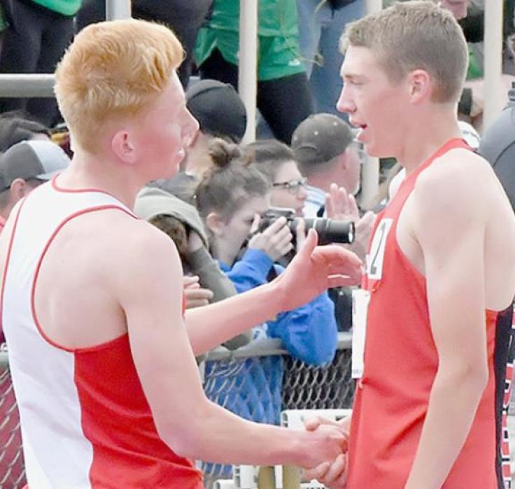 Ty Schlueter (right) and Grant Lander of Homer (left) exchange congratulations following the 1600 Meter Run.