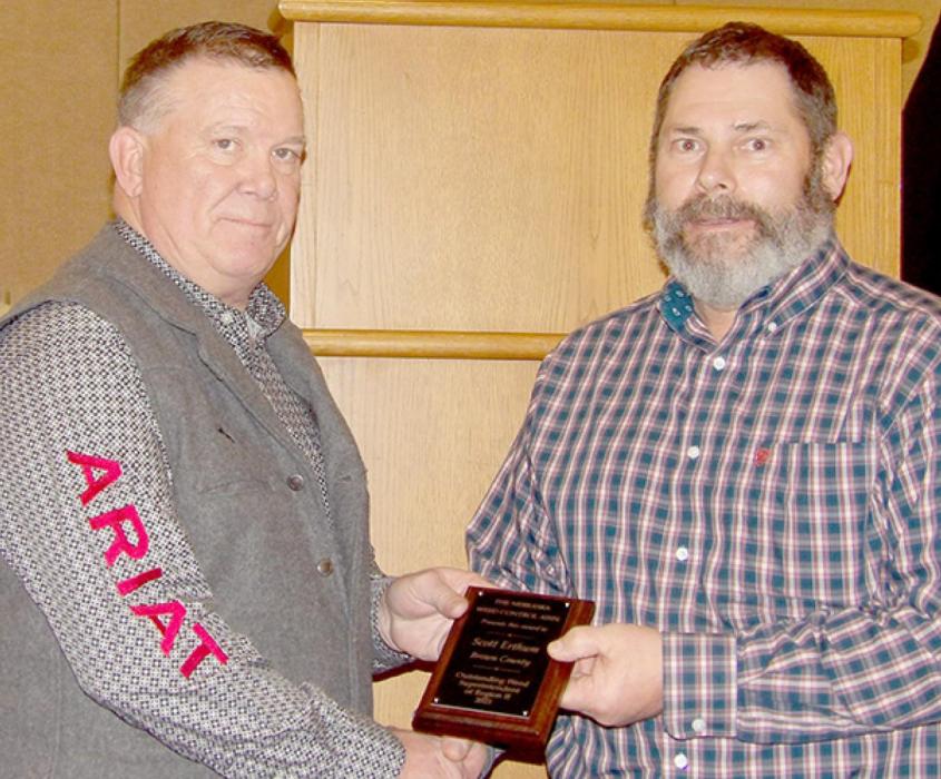 Nebraska Weed Control Association President John Bebout (left) presents the NWCA award for Region 2 to Brown County Weed Superintendent Scott Erthum (right).