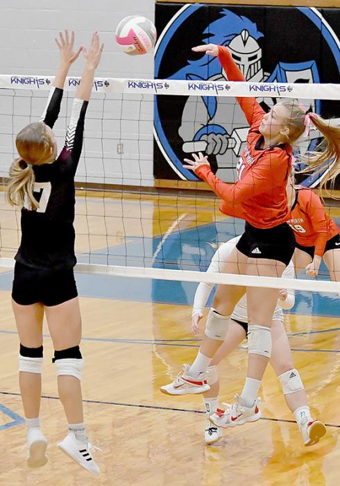 Kendyl Delimont hits cross court for a point against the Stuart Broncos. Delimont had three kills against Stuart.