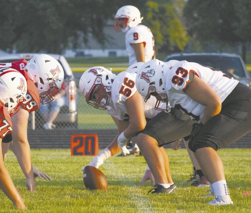 Junior Kyle Fernandez prepares to snap the ball during the football team's scrimmage.
