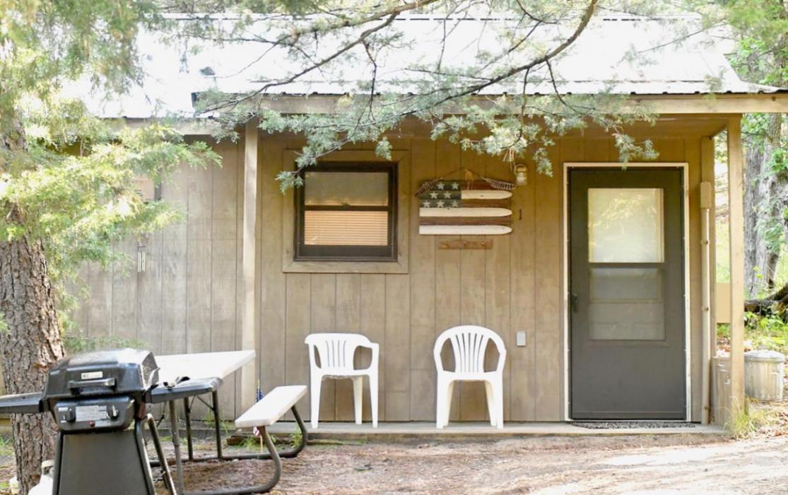 There are seven cabins for rent at Pine Valley Resort, each tucked back privately in the trees along a loop that encircles a covered pavilion with an outdoor kitchen, television and yard games. On both the east and west sides of the resort land are meadows filled with wildlife and trails leading to the Long Pine Wildlife Management Area.