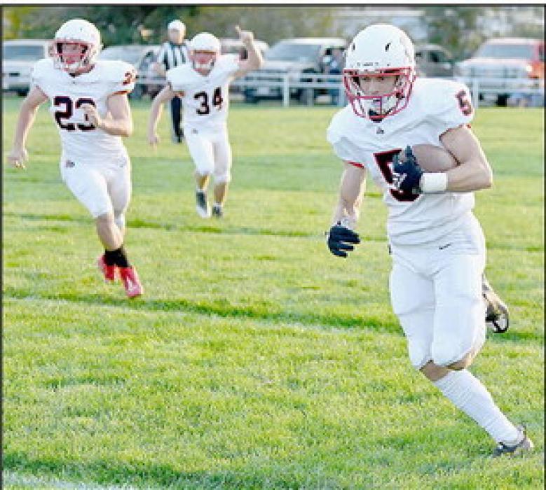 Owen Blumenstock takes the ball around the left end on the first play from scrimmage for the Bulldogs and scores on a 58 yard run.