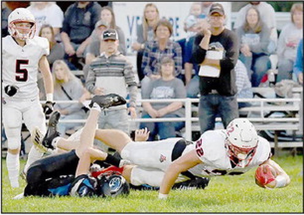 With his legs still off the ground, Carter Nelson stretches for a touchdown. Nelson had three touchdowns against the Cougars.
