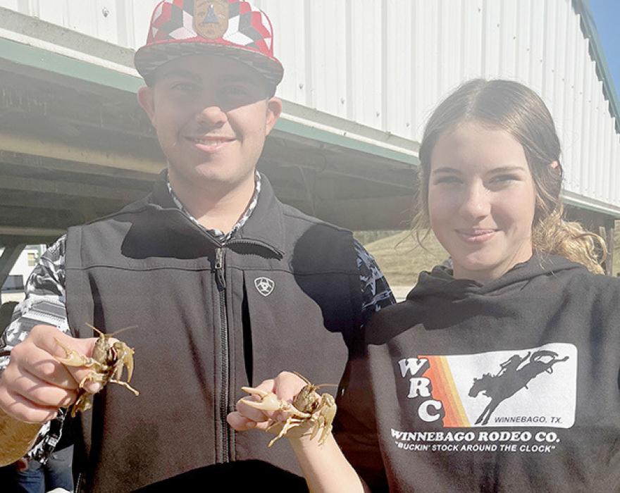While at the National FFA Convention, students attended industry tours. At Ozark Fisheries they were able to see fish production on a large scale. Tyrin Daniels (left) and Zaily Daniels (right) were able to hold crawfish while on the tour.