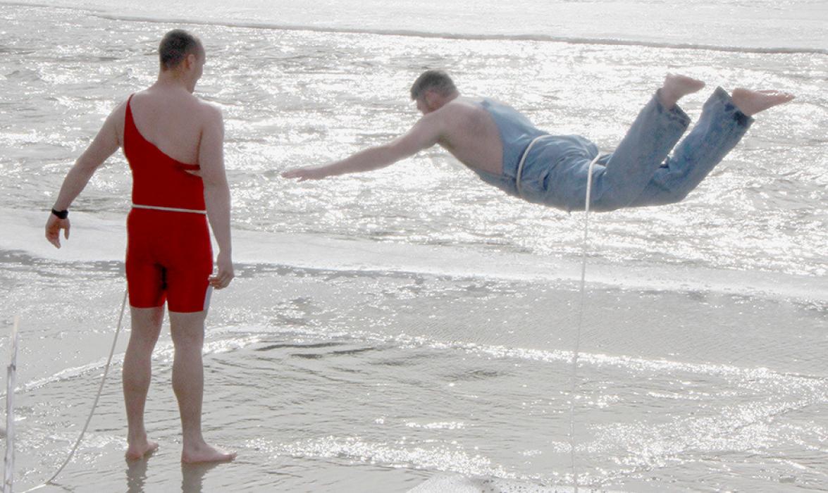 Spectators and dippers enjoyed 55 degree temperatures for the 25th Annual Polar Bear Dip held on the north side of the Niobrara River near Meadville. Over 40 people braved the 22 degree water to participate in the 25th annual dip. With ice thickness running at 12 inches, a section of ice was cut out to allow the dippers to immerse themselves.