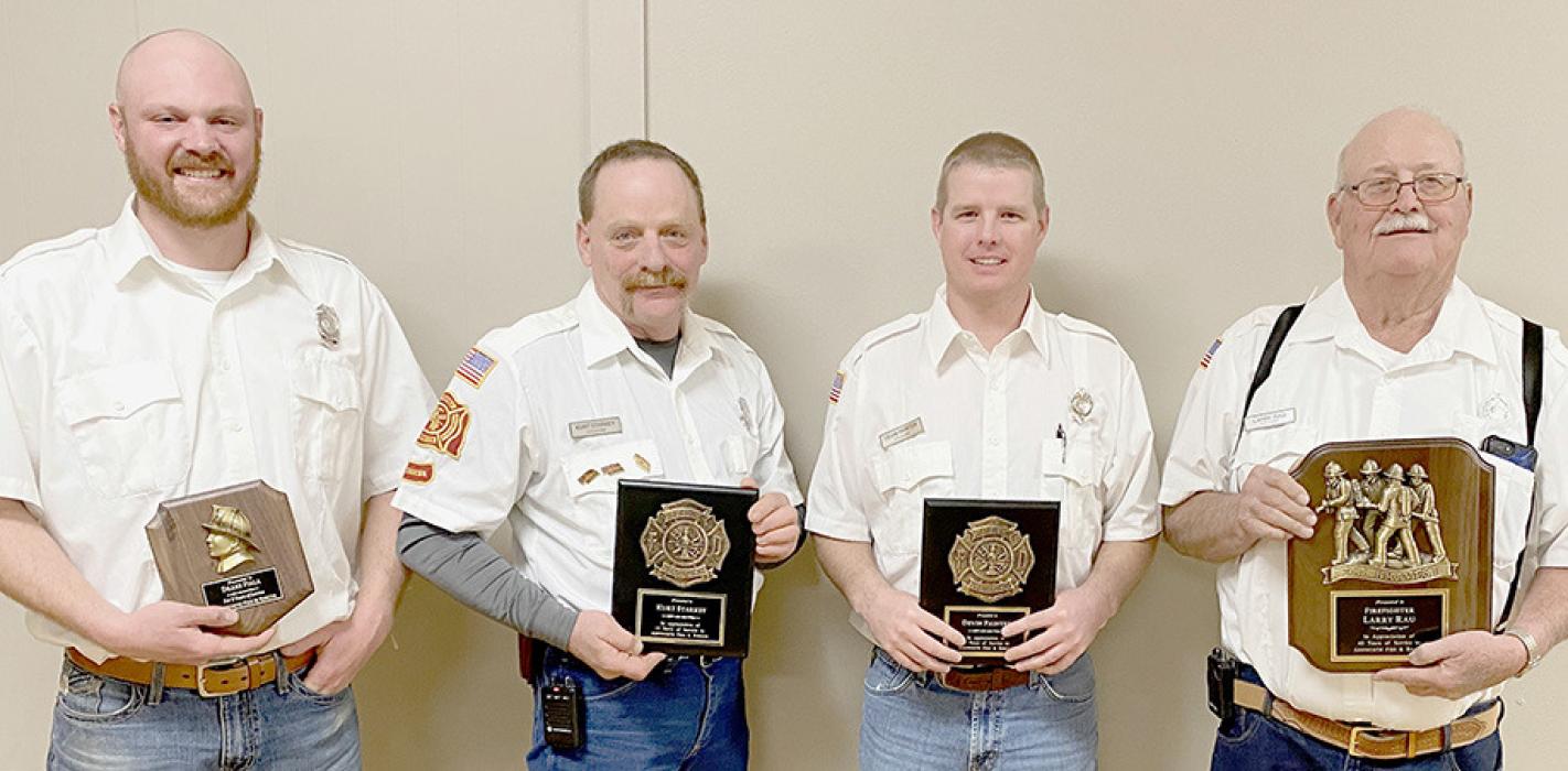 Several firemen were recognized for their years of service to the Ainsworth Fire Department. Those recognized were (left to right) Drake Fiala - 5 years, Kurt Starkey and Devin Painter - 15 years and Larry Rau - 40 years. Also receiving service awards, but not pictured, were Hunter Nickless - 5 years, Justin Nickless - 15 years, Carl Hart - 25 years and Bruce Dannatt - 35 years.