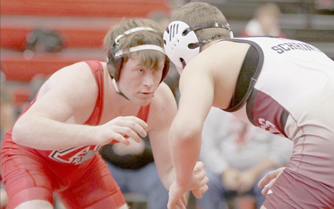 AHS junior Jensen Williams wrestles in the 160 lb. weight class against Brandon Schriner of Gothenburg.