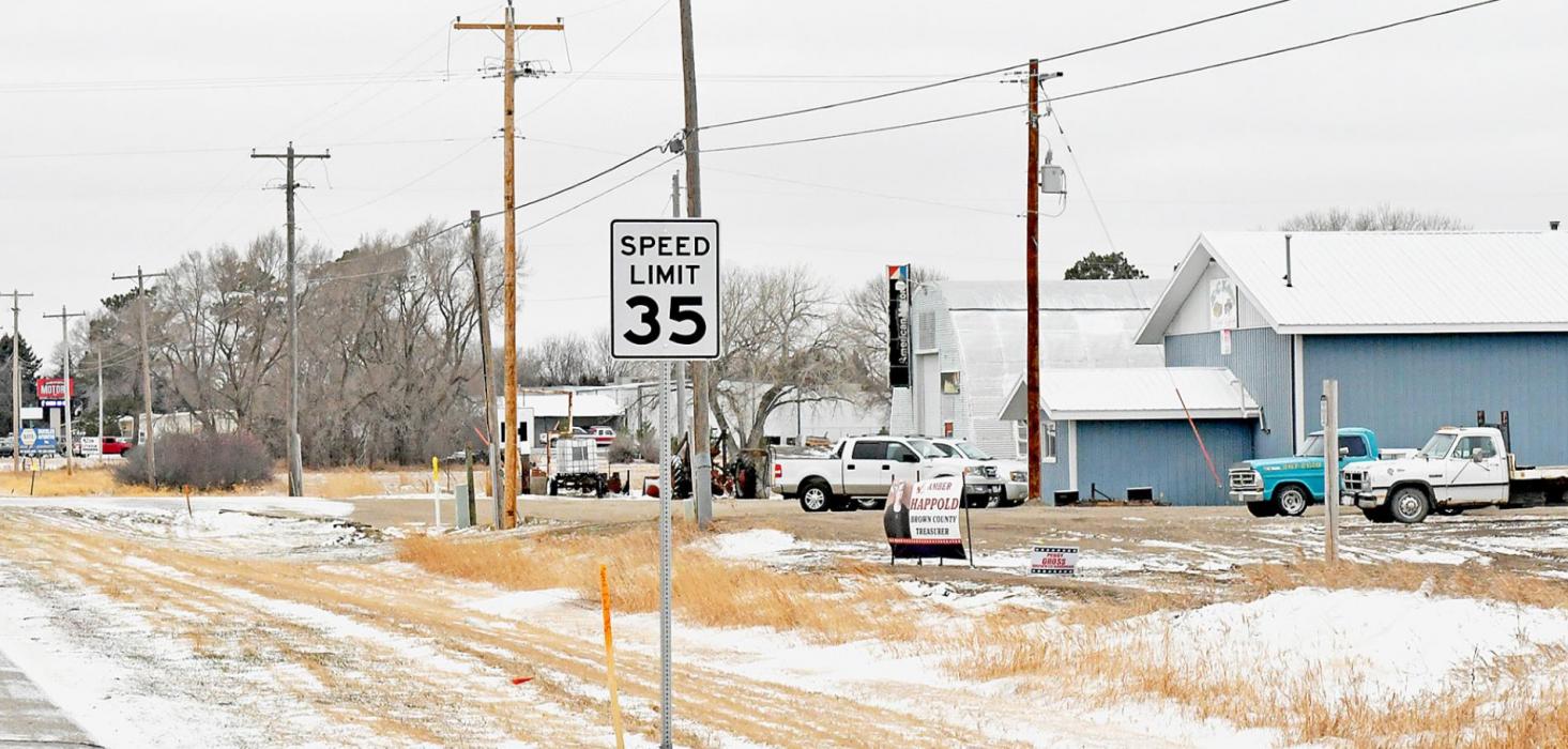 Coming into Ainsworth from the east on Highway 20, the 35 mph speed limit sign was moved from just east of Bomgaars to just east of K-C Kollision, which is shown on the right side of the photo above. The 45 mph and reduced speed ahead signs were moved farther east accordingly. The movement was necessitated by the extension of Highway 20’s center turning lane to the edge of city boundaries on both the east and west.